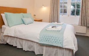 A bedroom available for bed and breakfast at University College Oxford
