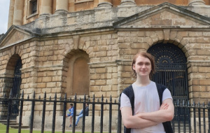 Alexander standing in front of the Radcliffe Camera