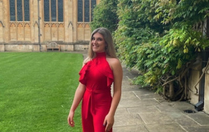 Charlotte Avery on quad in red jumpsuit