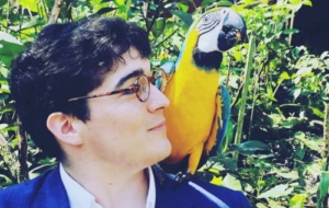 Antone Martinho-Truswell with a macaw