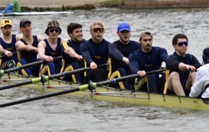 rowers and cox in eights boat