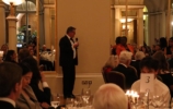 a speaker at a formal dinner