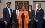 valerie amos in the middle of four smartly dressed students