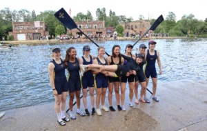 W1 - group of women rowers in front of blades