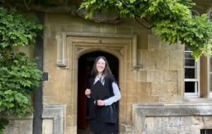 Elspeth at matriculation in front of the wisteria