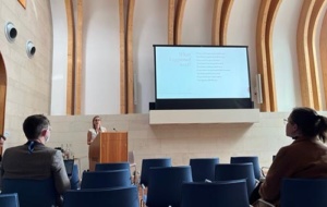 woman presenting at a lecture