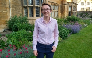Rebecca wearing a shirt and trousers in the Master's Garden