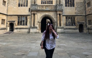 Woman smiling outside the Bodleian Library