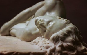Close up of a white marble statue's head