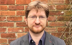 a man with glasses and a ginger beard