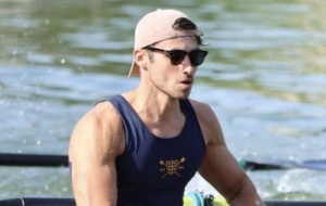 Man in a boat wearing UCBC kit
