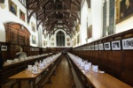 Hall with long tables set for a formal meal