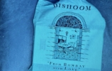 A blue bag which says Dishoom and From Bombay with Love along with an illustration of a dinning room