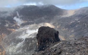 dramatic volcanic landscape with smoke