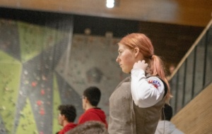 Person in fencing outfit concentrating