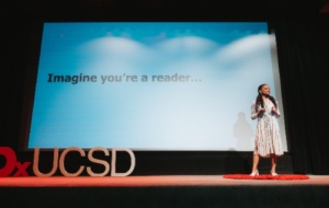 Woman giving a TED talk about being a reader