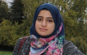 Woman wearing navy hijab and colourful scarf