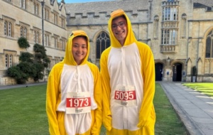 Team Univ: Town and Gown 2025 - two runners in bird costumes