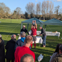 Univ Football Day 2026 - player lifting trophy
