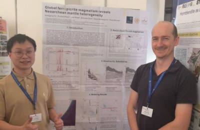 Xiangying Ye standing in front of his poster with Professor Richard Palin