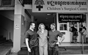 Three doctors standing outside the Children's Surgical Centre in Phnom Penh, Cambodia