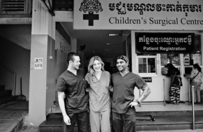 Three doctors standing outside the Children's Surgical Centre in Phnom Penh, Cambodia